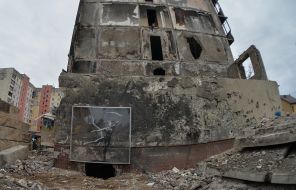 Graffiti on a destroyed high-rise building in Irpen, which is being dismantled