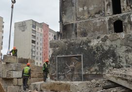 Graffiti on a destroyed high-rise building in Irpen, which is being dismantled