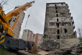 Graffiti on a destroyed high-rise building in Irpen, which is being dismantled