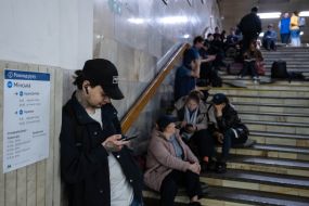 People are waiting for the air alarm at the metro station