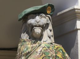 Sculpture of a lion in military uniform