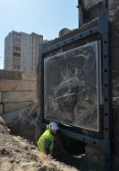 A piece of wall with graffiti by Banksy from a destroyed house in Irpen