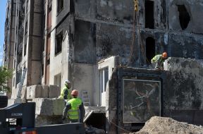 A piece of wall with graffiti by Banksy from a destroyed house in Irpen