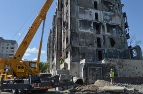 A piece of wall with graffiti by Banksy from a destroyed house in Irpen