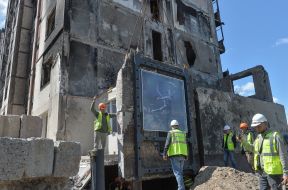 A piece of wall with graffiti by Banksy from a destroyed house in Irpen