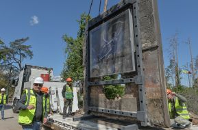 A piece of wall with graffiti by Banksy from a destroyed house in Irpen