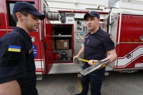A rescuer examines an American fire truck