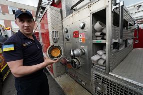 A rescuer examines an American fire truck