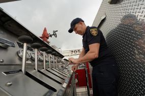 A rescuer examines an American fire truck