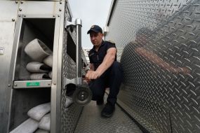 A rescuer examines an American fire truck