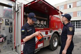 A rescuer examines an American fire truck