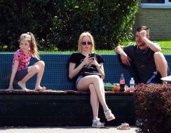 People rest sitting on a bench