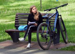 Girl resting on a park bench