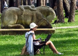 Girl with laptop in the park