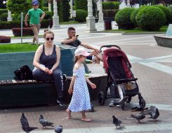 People rest sitting on a bench