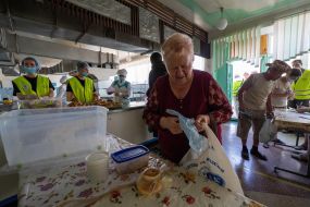 Volunteers handing out free meals
