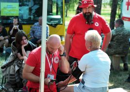 Medical worker measures the pressure of a woman