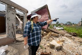 Local resident Olena Hryshina in her yard in the Kharkiv region
