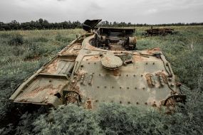 Wreck of a blown up tank in a field in the Kharkiv region