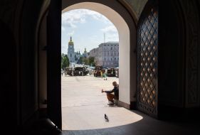 A man begs for alms near St. Michael's Cathedral