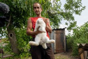 Local resident Mikhail Steshenko with his rabbit