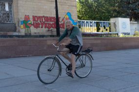 A man rides a bicycle