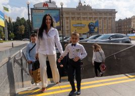 Schoolchildren at the entrance to the subway station in Kharkiv