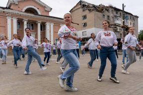 Girls in embroidered dresses are dancing