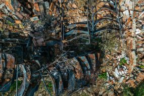 Burnt library shelves of the library destroyed by the Russian occupiers in the village of Pidgaine, Kyiv region