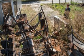 Burnt library shelves of the library destroyed by the Russian occupiers in the village of Pidgaine, Kyiv region