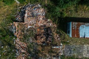 Burnt library shelves of the library destroyed by the Russian occupiers in the village of Pidgaine, Kyiv region