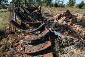 Burnt library shelves of the library destroyed by the Russian occupiers in the village of Pidgaine, Kyiv region