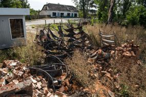 Burnt library shelves of the library destroyed by the Russian occupiers in the village of Pidgaine, Kyiv region