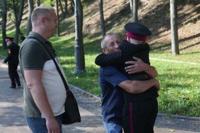 A cadet of Lyceum 23 "Cadet Corps" greets his family