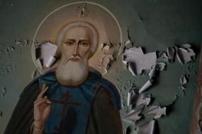 Damaged frescoes inside the Church of the Exaltation of the Cross in the town of Izyum, Kharkiv Region