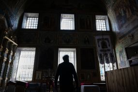 The rector of the church, Father Bohdan, inside the Church of the Exaltation of the Cross in the city of Izyum, Kharkiv region
