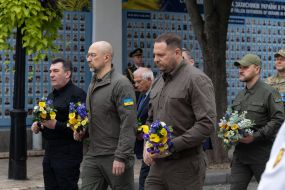 Participants of the flower-laying ceremony
