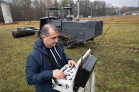 The operator of the MP3101 demining machine holds the remote control
