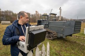 The operator of the MP3101 demining machine holds the remote control