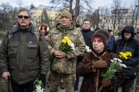 On the Day of Dignity and Freedom, people with flowers honored the memory of activists who died during the Revolution of Dignity