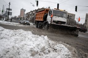 A special utility vehicle cleans the roadway in Kyiv