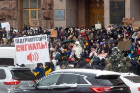 Participants of the action with posters near the KMDA ​