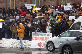 Participants of the action with posters near the KMDA ​