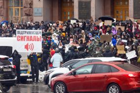 Participants of the action with posters near the KMDA ​