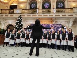 The choir performs the Christmas song "Shchedryk" by the Ukrainian composer Mykola Leontovych