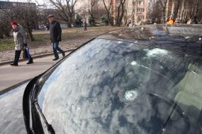 A car damaged as a result of a missile strike
