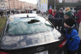 A car damaged as a result of a missile strike
