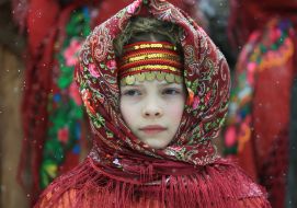 A girl in a wreath and a scarf