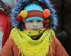 A girl in a wreath and a scarf
