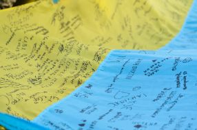 The largest National flag with wishes from children and military